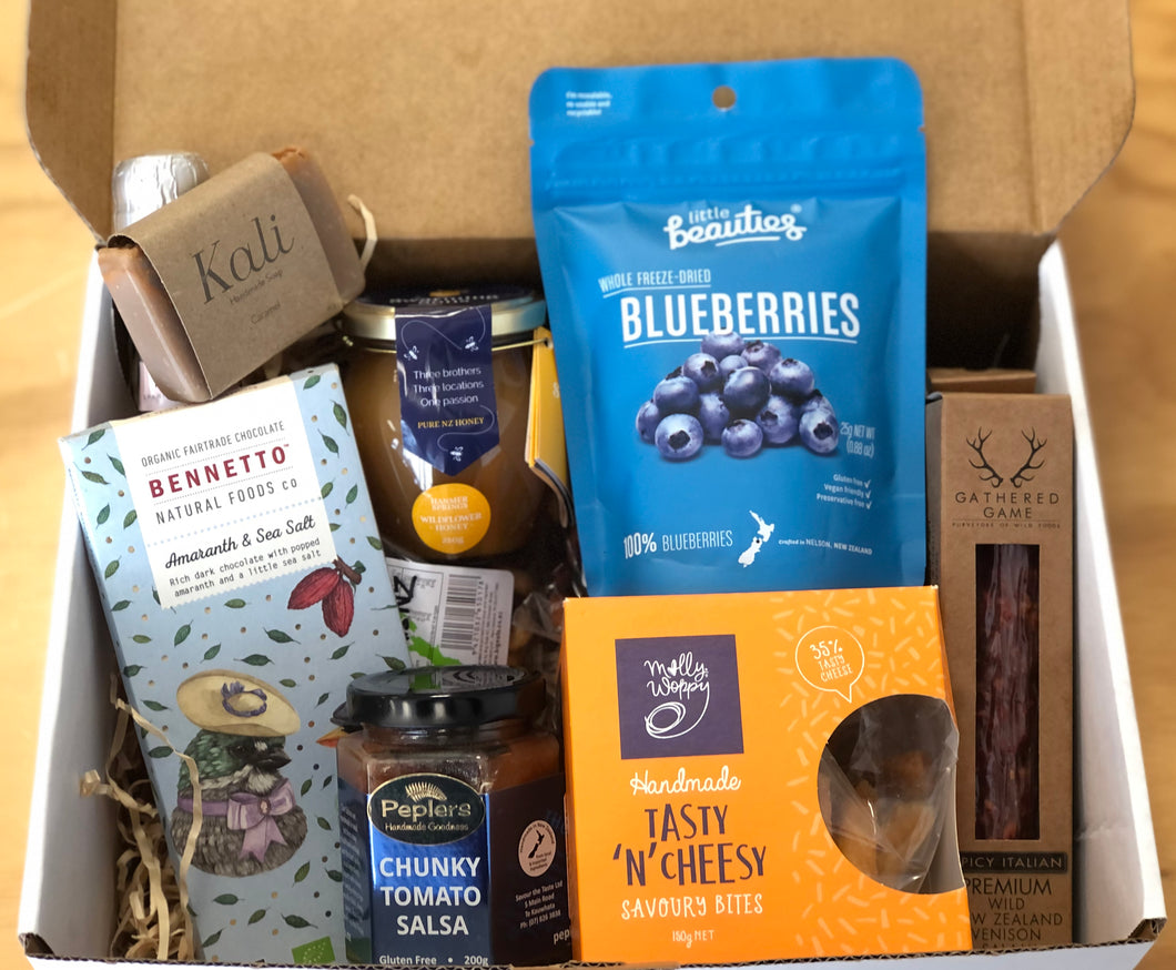 A gift box of soap, chocolate, blueberries, honey, salsa, venison and more.
