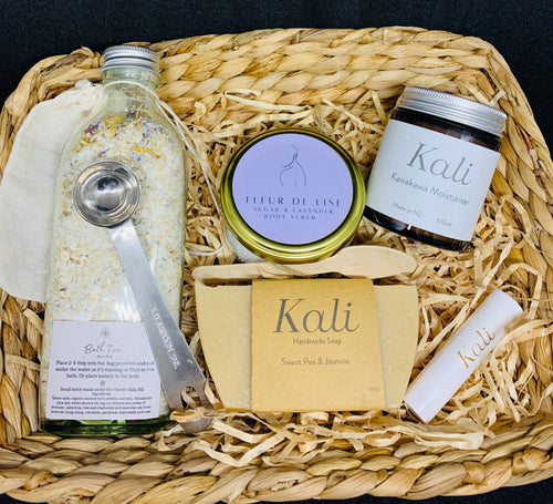 A gift basket with bath tea, soap, body scrub and moisturiser