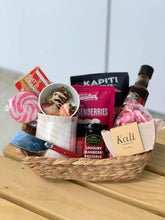 Load image into Gallery viewer, A gift basket with soap, preserves, and a selection of sweets
